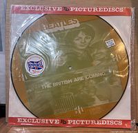 Front view of 12-inch Beatles picture disc in sleeve