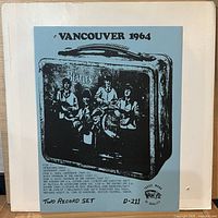 Front of sleeve with blue photocopy insert titled Vancouver 1964