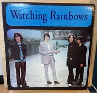 Front cover of Watching Rainbows LP showing title and Beatles photo