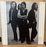 Front cover showing black-and-white portrait of the four Beatles