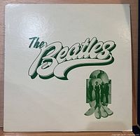 Front album cover with green Beatles logo