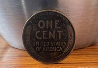 Reverse of 1937 wheat cent showing denomination and wheat ears