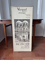 Front view of framed poster showing full graphic, text and frame