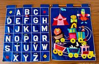 Alphabet and circus train wall hangings side-by-side front view