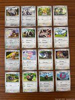 Front view of all 16 cards laid out 4×4 on table