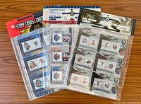 Front view of all three sealed NHL stamp card packs