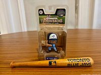 Front view of sealed figure and mini bat