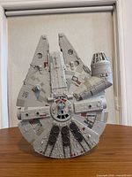 Front angled view of full Millennium Falcon model standing vertically