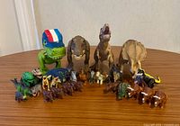 Front view of 29 dinosaur toys arranged on tabletop
