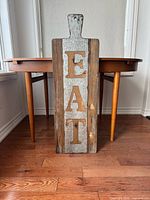 Front view showing galvanized panel and letters