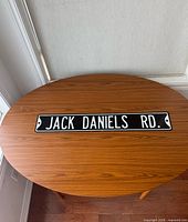 Sign on wooden surface, full view