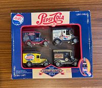 Front of boxed set showing four die-cast trucks