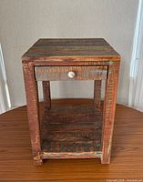 front view showing drawer, knob, shelf and overall finish