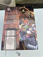 Front of retail box showing Acoustic Research AW825 wireless outdoor speaker image and branding