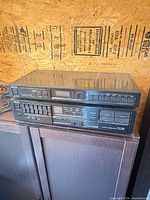 Front view of stacked Akai AT-A102 tuner and AM-A202 amplifier