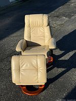 Recliner and ottoman front view showing upholstery and bases