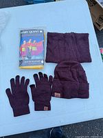 Full lot showing packaged Mary Quant poncho, knit gaiter, beanie and touchscreen gloves