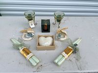 All items laid out: votive holders, boxed votive, heart candle, taper bundles, rope candles