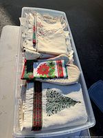 Overall bin showing mixed holiday linens