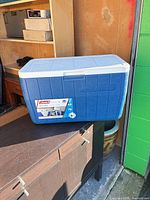 Front and top view of blue Coleman chest cooler