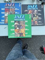 Three Jazz Spectrum 5-record box sets on table