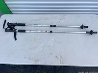 Both aluminum trekking poles full length on table