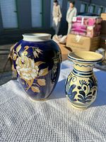 Both vases side by side showing size difference and decoration