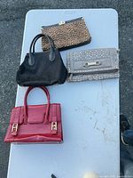 All four handbags laid out for overall view