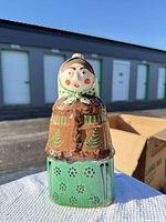 Front view showing face, colors and pierced skirt pattern