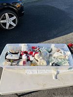 Top view of bin showing mixed ornaments and decorations