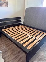 Full view of queen platform bed frame with slats installed
