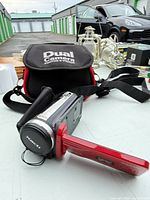 Camcorder open with LCD panel and case visible