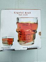Front of box showing skull shot glass and set of four