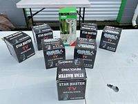 Seven boxed units on table; six Star Master boxes visible plus another item in background