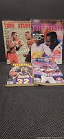 All four Tuff Stuff sports price guide magazines upright and on display