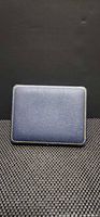 closed navy blue textured presentation case with gold trim