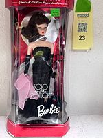 Front view of boxed Barbie doll and accessories