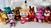 All eight FNAF plush toys lined up