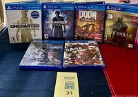 Front view of all six PS4 game cases