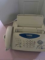 Front view of Brother Intellifax 775 showing handset, keypad, trays