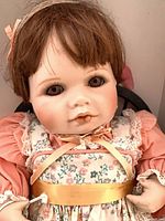 Close-up of doll’s face and upper outfit