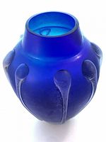 Full view of cobalt blue vase showing applied prunts and shape