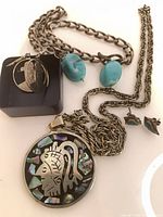 All jewelry pieces grouped: pendant necklace, turquoise bracelets, coin earrings, turquoise earrings