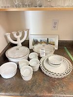 Full lot overview on countertop showing all ceramic pieces