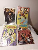 Group shot of all four bagged comics