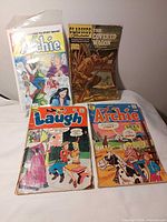 Group shot of all four comic books in lot