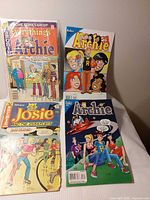 Group shot showing all four comic books