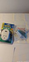 Both packaged items: Jackson travel adapter and Tech RJ45 coupler