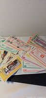 Stack of assorted coupons from multiple retailers