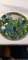 Full view of tray containing assorted marbles